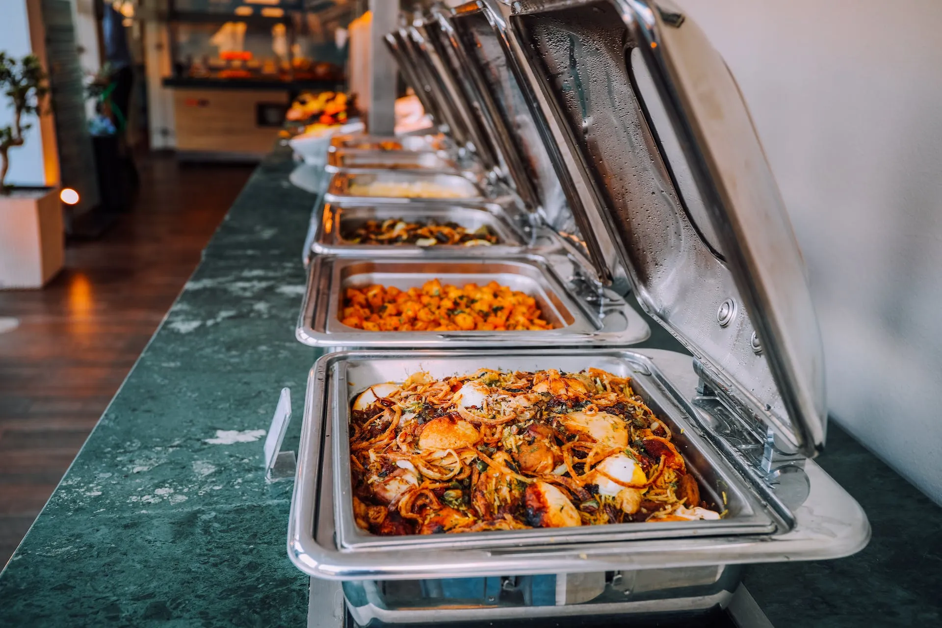 open buffet containers with various foods